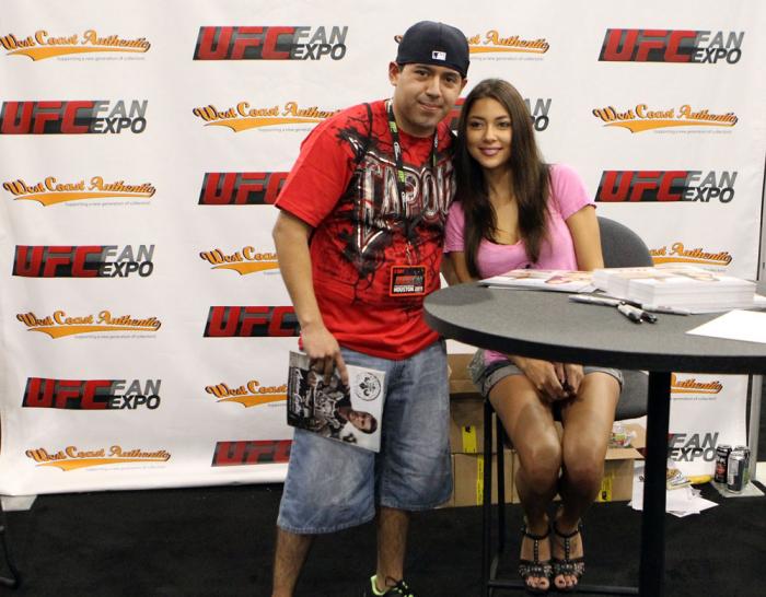 UFC Octagon Girl Arianny Celeste poses for photos with fans at the UFC Fan Expo