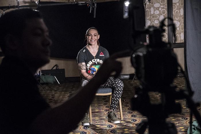 UFC featherweight champion Cris Cyborg smiles during her promotional UFC 232 interview