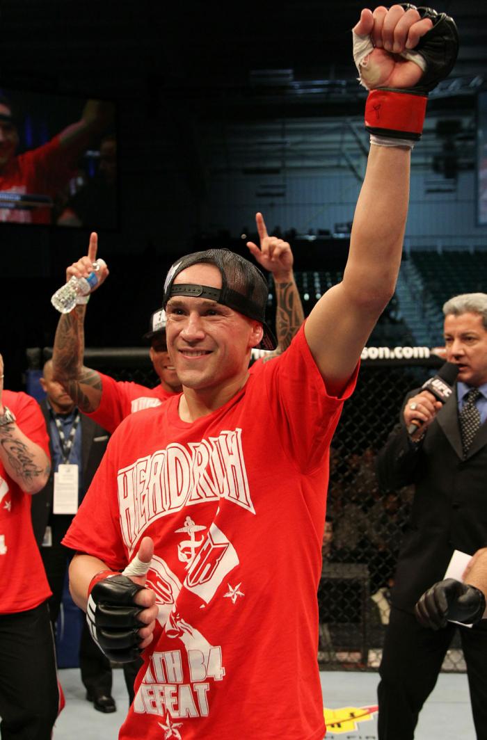 Mark Hominick celebrates his victory over George Roop.