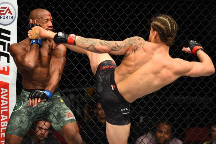 GLENDALE, AZ - APRIL 14: (R-L) Luke Sanders kicks Patrick Williams in their bantamweight fight during the UFC Fight Night event at the Gila Rivera Arena on April 14, 2018 in Glendale, Arizona. (Photo by Josh Hedges/Zuffa LLC/Zuffa LLC via Getty Images)