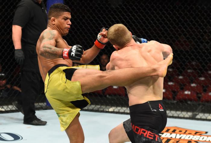 GLENDALE, AZ - APRIL 14: (L-R) Gilbert Burns of Brasil kicks Dan Moret in their lightweight fight during the UFC Fight Night event at the Gila Rivera Arena on April 14, 2018 in Glendale, Arizona. (Photo by Josh Hedges/Zuffa LLC/Zuffa LLC via Getty Images