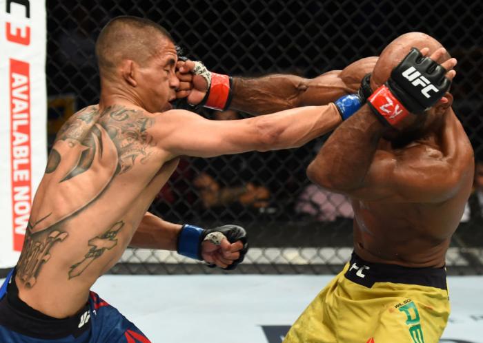 GLENDALE, AZ - APRIL 14: (L-R) John Moraga exchanges punches with Wilson Reis of Brazil in their flyweight fight during the UFC Fight Night event at the Gila Rivera Arena on April 14, 2018 in Glendale, Arizona. (Photo by Josh Hedges/Zuffa LLC/Zuffa LLC v