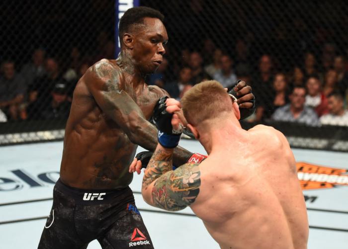 GLENDALE, AZ - APRIL 14: (L-R) Israel Adesanya of Nigeria punches Marvin Vettori of Italy in their middleweight fight during the UFC Fight Night event at the Gila Rivera Arena on April 14, 2018 in Glendale, Arizona. (Photo by Josh Hedges/Zuffa LLC/Zuffa