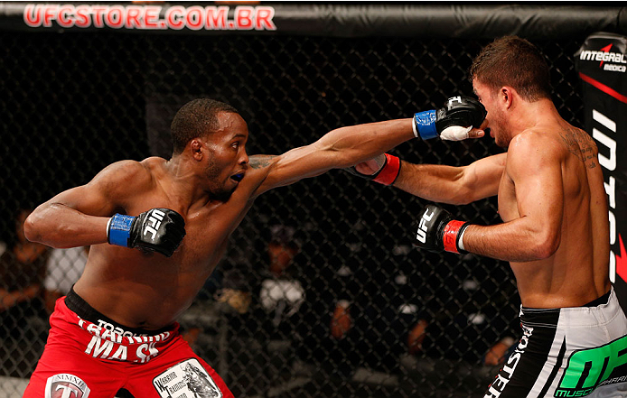 BELO HORIZONTE, BRAZIL - SEPTEMBER 04: (L-R) Sean Spencer punches Yuri Villefort in the welterweight fight during the UFC on FOX Sports 1 event at Mineirinho Arena on September 4, 2013 in Belo Horizonte, Brazil. (Photo by Josh Hedges/Zuffa LLC/Zuffa LLC