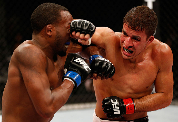 BELO HORIZONTE, BRAZIL - SEPTEMBER 04: (R-L) Yuri Villefort punches Sean Spencer in the welterweight fight during the UFC on FOX Sports 1 event at Mineirinho Arena on September 4, 2013 in Belo Horizonte, Brazil. (Photo by Josh Hedges/Zuffa LLC/Zuffa LLC