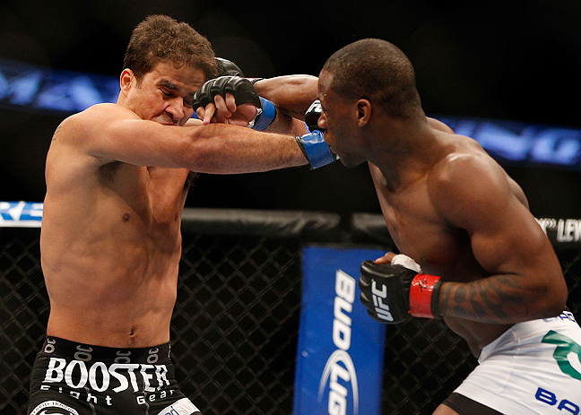 ANAHEIM, CA - FEBRUARY 23: (R-L) Nah-Shon Burrell punches Yuri Villefort in their welterweight bout during UFC 157 at Honda Center on February 23, 2013 in Anaheim, California. (Photo by Josh Hedges/Zuffa LLC/Zuffa LLC via Getty Images) *** Local Caption