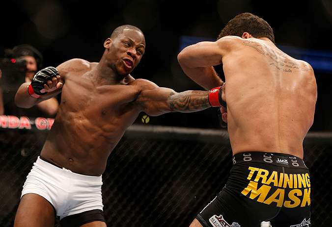 ANAHEIM, CA - FEBRUARY 23: (L-R) Nah-Shon Burrell punches Yuri Villefort in their welterweight bout during UFC 157 at Honda Center on February 23, 2013 in Anaheim, California. (Photo by Josh Hedges/Zuffa LLC/Zuffa LLC via Getty Images) *** Local Caption