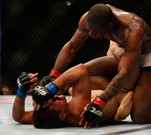 ANAHEIM, CA - FEBRUARY 23: Nah-Shon Burrell (top) punches Yuri Villefort in their welterweight bout during UFC 157 at Honda Center on February 23, 2013 in Anaheim, California. (Photo by Josh Hedges/Zuffa LLC/Zuffa LLC via Getty Images) *** Local Caption