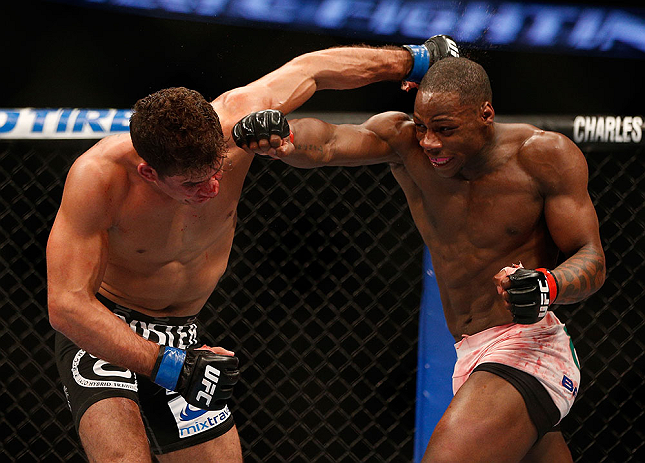 ANAHEIM, CA - FEBRUARY 23: (R-L) Nah-Shon Burrell punches Yuri Villefort in their welterweight bout during UFC 157 at Honda Center on February 23, 2013 in Anaheim, California. (Photo by Josh Hedges/Zuffa LLC/Zuffa LLC via Getty Images) *** Local Caption