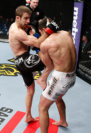 LONDON, ENGLAND - FEBRUARY 16: (L-R) Phil Harris knees Ulysses Gomez in their flyweight fight during the UFC on Fuel TV event on February 16, 2013 at Wembley Arena in London, England. (Photo by Josh Hedges/Zuffa LLC/Zuffa LLC via Getty Images)