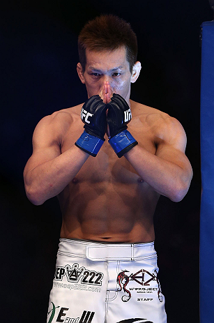 DENVER, CO - AUGUST 11: Eiji Mitsuoka prepares to enter the Octagon before his bout against Nik Lentz at UFC 150 inside Pepsi Center on August 11, 2012 in Denver, Colorado. (Photo by Josh Hedges/Zuffa LLC/Zuffa LLC via Getty Images)