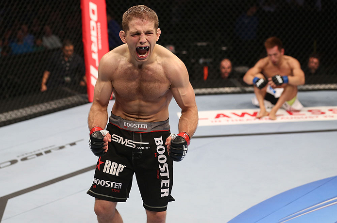 DENVER, CO - AUGUST 11: Nik Lentz (L) reacts after defeating Eiji Mitsuoka during their featherweight bout at UFC 150 inside Pepsi Center on August 11, 2012 in Denver, Colorado. (Photo by Nick Laham/Zuffa LLC/Zuffa LLC via Getty Images)