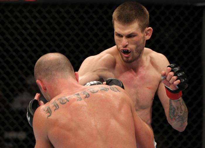 OMAHA, NE - FEBRUARY 15: (R-L) Tim Means punches Bernardo Magalhaes during the UFC on FUEL TV event at Omaha Civic Auditorium on February 15, 2012 in Omaha, Nebraska. (Photo by Josh Hedges/Zuffa LLC/Zuffa LLC via Getty Images) *** Local Caption *** Tim