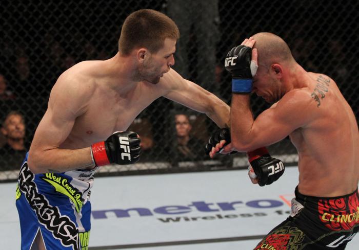 OMAHA, NE - FEBRUARY 15: (L-R) Tim Means punches Bernardo Magalhaes during the UFC on FUEL TV event at Omaha Civic Auditorium on February 15, 2012 in Omaha, Nebraska. (Photo by Josh Hedges/Zuffa LLC/Zuffa LLC via Getty Images) *** Local Caption *** Tim