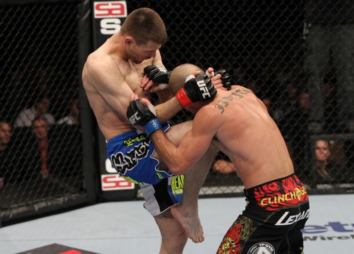 OMAHA, NE - FEBRUARY 15: (L-R) Tim Means delivers a knee strike against Bernardo Magalhaes during the UFC on FUEL TV event at Omaha Civic Auditorium on February 15, 2012 in Omaha, Nebraska. (Photo by Josh Hedges/Zuffa LLC/Zuffa LLC via Getty Images) ***
