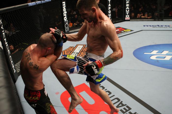 OMAHA, NE - FEBRUARY 15: (R-L) Tim Means delivers a knee strike against Bernardo Magalhaes during the UFC on FUEL TV event at Omaha Civic Auditorium on February 15, 2012 in Omaha, Nebraska. (Photo by Josh Hedges/Zuffa LLC/Zuffa LLC via Getty Images) ***