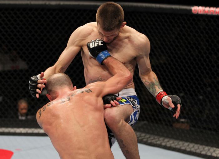 OMAHA, NE - FEBRUARY 15: (L-R) Bernardo Magalhaes and Tim Means trade strikes during the UFC on FUEL TV event at Omaha Civic Auditorium on February 15, 2012 in Omaha, Nebraska. (Photo by Josh Hedges/Zuffa LLC/Zuffa LLC via Getty Images) *** Local Captio