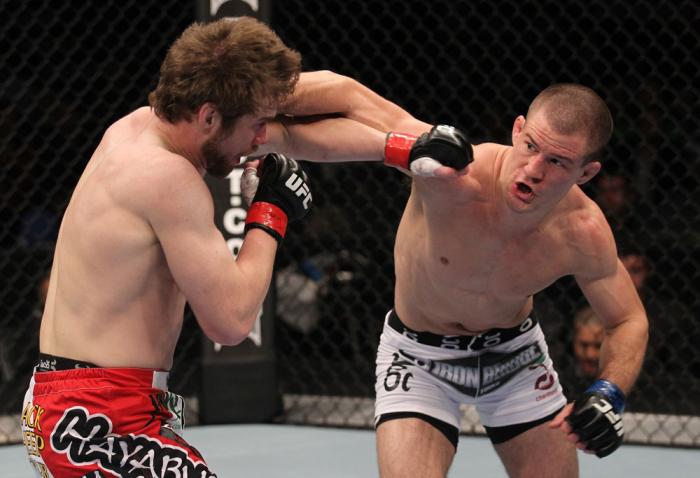 TORONTO, ON - DECEMBER 10: (R-L) John Cholish punches Mitch Clarke during the UFC 140 event at Air Canada Centre on December 10, 2011 in Toronto, Canada. (Photo by Nick Laham/Zuffa LLC/Zuffa LLC)