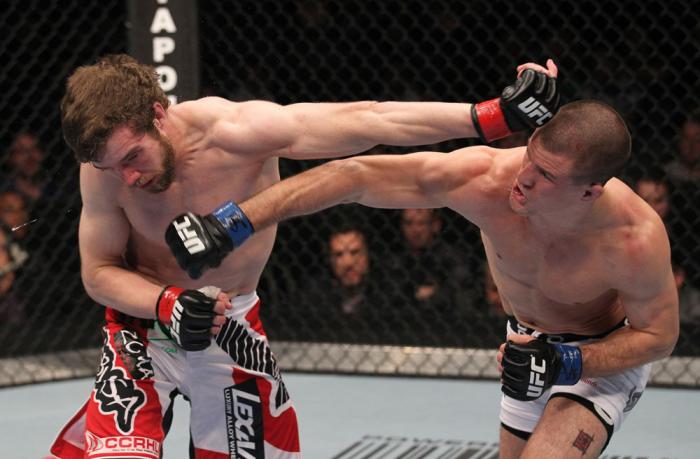 TORONTO, ON - DECEMBER 10: (R-L) John Cholish punches Mitch Clarke during the UFC 140 event at Air Canada Centre on December 10, 2011 in Toronto, Canada. (Photo by Nick Laham/Zuffa LLC/Zuffa LLC)
