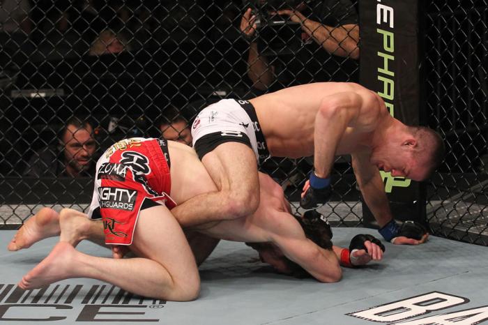 TORONTO, ON - DECEMBER 10: (R-L) John Cholish punches Mitch Clarke during the UFC 140 event at Air Canada Centre on December 10, 2011 in Toronto, Canada. (Photo by Nick Laham/Zuffa LLC/Zuffa LLC)