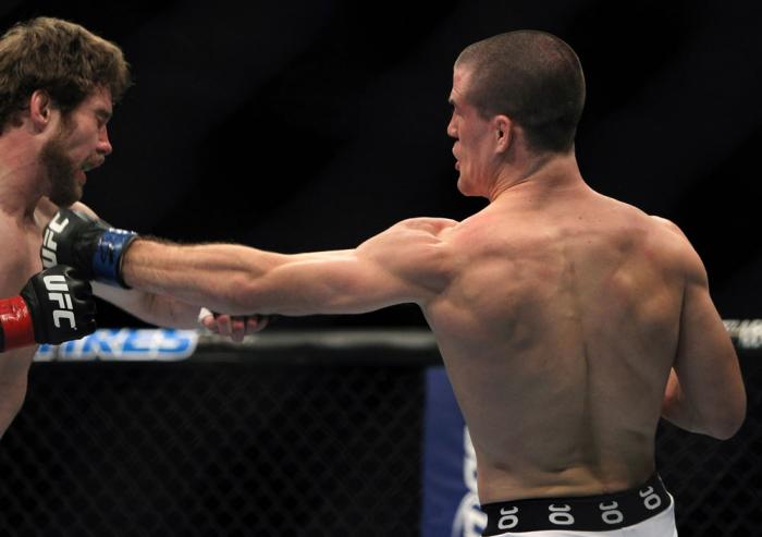 TORONTO, ON - DECEMBER 10: (R-L) John Cholish punches Mitch Clarke during the UFC 140 event at Air Canada Centre on December 10, 2011 in Toronto, Ontario, Canada. (Photo by Josh Hedges/Zuffa LLC/Zuffa LLC via Getty Images)