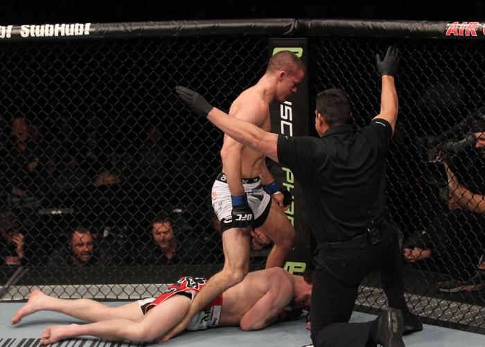 TORONTO, ON - DECEMBER 10: (R-L) Referee John McCarthy stops the bout as John Cholish (standing) defeats Mitch Clarke by TKO during the UFC 140 event at Air Canada Centre on December 10, 2011 in Toronto, Canada. (Photo by Nick Laham/Zuffa LLC/Zuffa LLC)