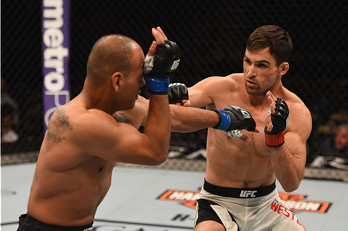 LAS VEGAS, NV - JANUARY 02: (R-L) Sheldon Westcott of Canada punches Edgar Garcia of Mexico in their welterweight bout during the UFC 195 event inside MGM Grand Garden Arena on January 2, 2016 in Las Vegas, Nevada. (Photo by Josh Hedges/Zuffa LLC/Zuffa L