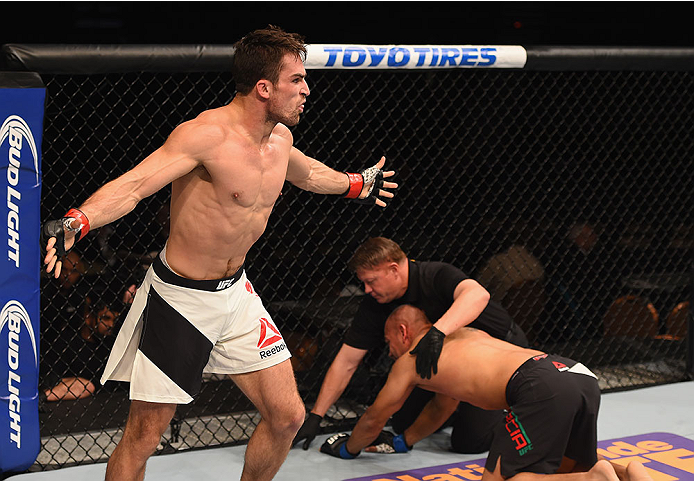 LAS VEGAS, NV - JANUARY 02: Sheldon Westcott of Canada (left) reacts to his victory over Edgar Garcia of Mexico in their welterweight bout during the UFC 195 event inside MGM Grand Garden Arena on January 2, 2016 in Las Vegas, Nevada. (Photo by Josh Hedg