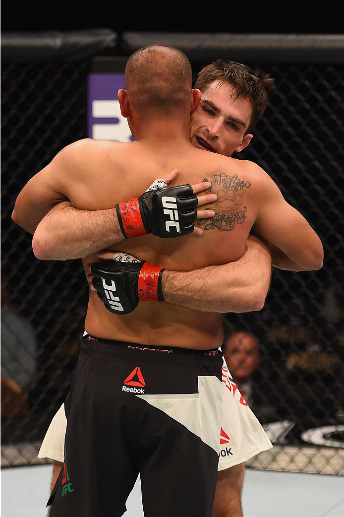 LAS VEGAS, NV - JANUARY 02: Sheldon Westcott of Canada (back) and Edgar Garcia of Mexico (front) embrace after their welterweight bout during the UFC 195 event inside MGM Grand Garden Arena on January 2, 2016 in Las Vegas, Nevada. (Photo by Josh Hedges/Z