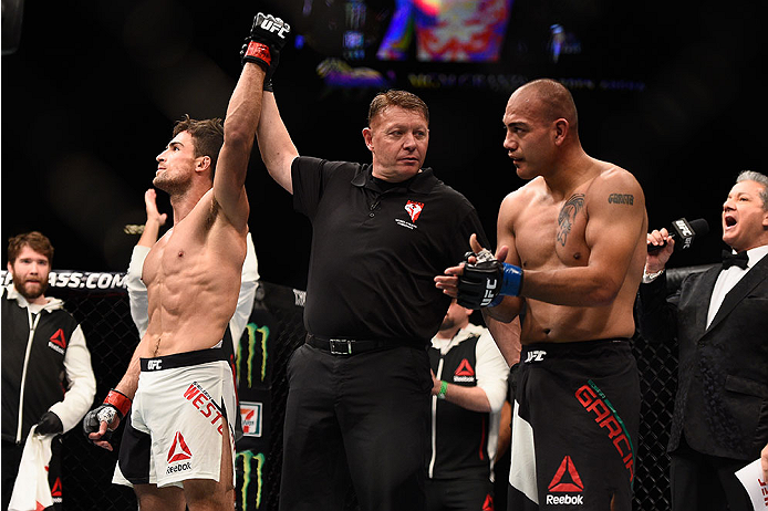 LAS VEGAS, NV - JANUARY 02: Sheldon Westcott of Canada (left) reacts to his victory over Edgar Garcia of Mexico (right) in their welterweight bout during the UFC 195 event inside MGM Grand Garden Arena on January 2, 2016 in Las Vegas, Nevada. (Photo by J