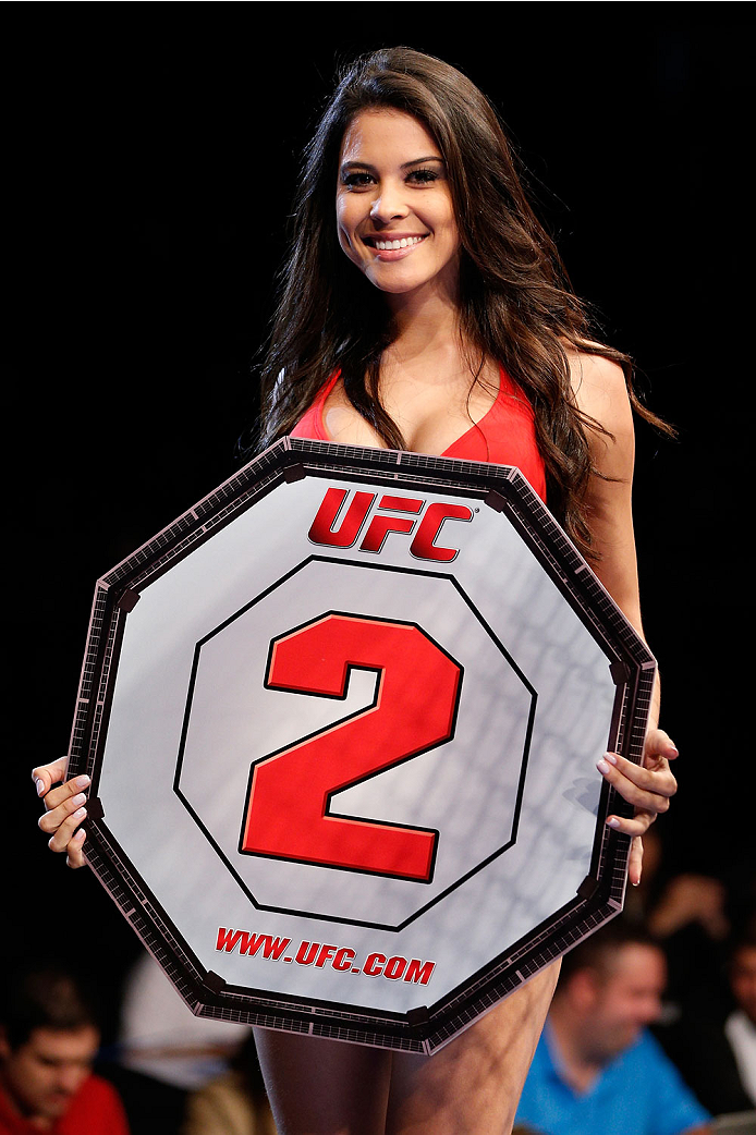 BELO HORIZONTE, BRAZIL - SEPTEMBER 04: UFC Octagon Girl Camila Rodrigues de Oliveira introduces a round during the UFC on FOX Sports 1 event at Mineirinho Arena on September 4, 2013 in Belo Horizonte, Brazil. (Photo by Josh Hedges/Zuffa LLC/Zuffa LLC via