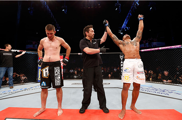BELO HORIZONTE, BRAZIL - SEPTEMBER 04: Ivan Jorge (R) reacts after his victory over Keith Wisniewski in their welterweight fight during the UFC on FOX Sports 1 event at Mineirinho Arena on September 4, 2013 in Belo Horizonte, Brazil. (Photo by Josh Hedge