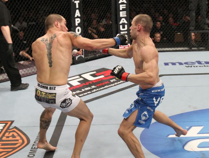 OMAHA, NE - FEBRUARY 15: (L-R) Justin Salas punches Anton Kuivanen during the UFC on FUEL TV event at Omaha Civic Auditorium on February 15, 2012 in Omaha, Nebraska. (Photo by Josh Hedges/Zuffa LLC/Zuffa LLC via Getty Images) *** Local Caption *** Anton
