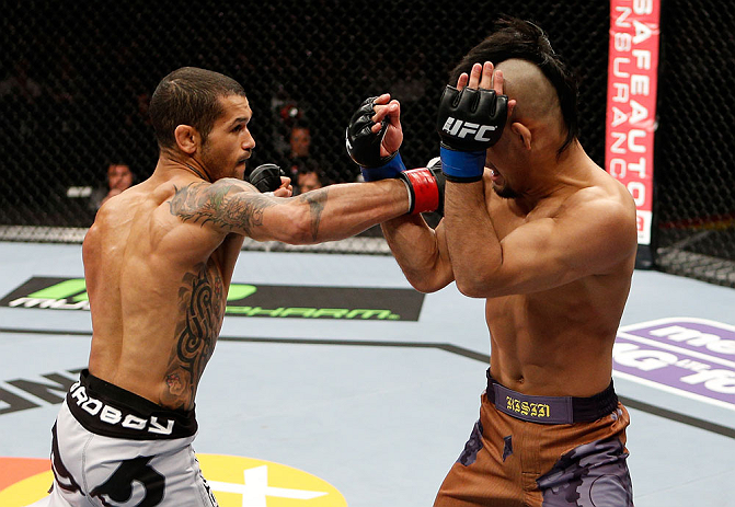 LONDON, ENGLAND - FEBRUARY 16: (L-R) Vaughan Lee punches Motonobu Tezuka in their bantamweight fight during the UFC on Fuel TV event on February 16, 2013 at Wembley Arena in London, England. (Photo by Josh Hedges/Zuffa LLC/Zuffa LLC via Getty Images)
