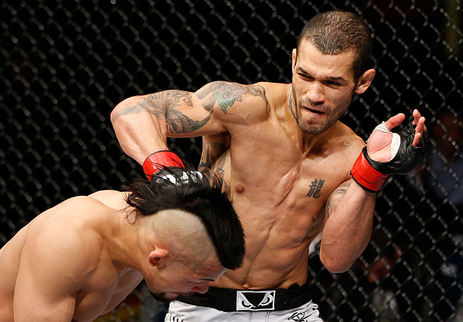 LONDON, ENGLAND - FEBRUARY 16: (R-L) Vaughan Lee punches Motonobu Tezuka in their bantamweight fight during the UFC on Fuel TV event on February 16, 2013 at Wembley Arena in London, England. (Photo by Josh Hedges/Zuffa LLC/Zuffa LLC via Getty Images)