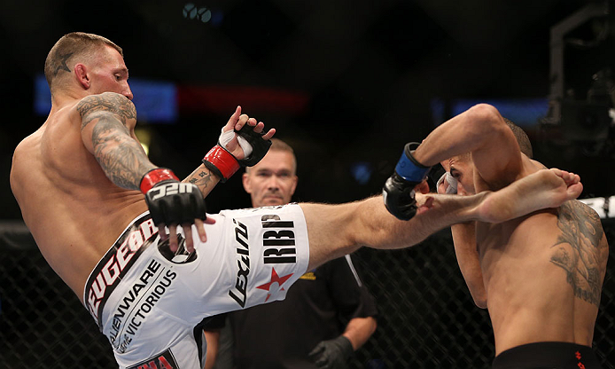 DENVER, CO - AUGUST 11: (L-R) Dustin Pague kicks Chico Camus during their bantamweight bout at UFC 150 inside Pepsi Center on August 11, 2012 in Denver, Colorado. (Photo by Josh Hedges/Zuffa LLC/Zuffa LLC via Getty Images)