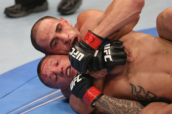 DENVER, CO - AUGUST 11: (R-L) Chico Camus attempts a rear choke submission against Dustin Pague during their bantamweight bout at UFC 150 inside Pepsi Center on August 11, 2012 in Denver, Colorado. (Photo by Nick Laham/Zuffa LLC/Zuffa LLC via Getty Image