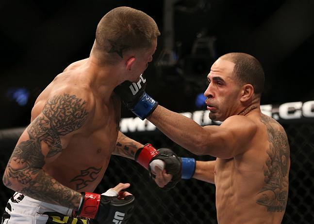 DENVER, CO - AUGUST 11: (R-L) Chico Camus punches Dustin Pague during their bantamweight bout at UFC 150 inside Pepsi Center on August 11, 2012 in Denver, Colorado. (Photo by Josh Hedges/Zuffa LLC/Zuffa LLC via Getty Images)