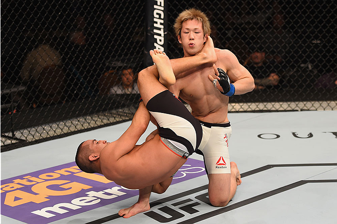 LAS VEGAS, NV - JANUARY 02: Joe Soto (left) attempts to submit Michinori Tanaka of Japan in their bantamweight bout during the UFC 195 event inside MGM Grand Garden Arena on January 2, 2016 in Las Vegas, Nevada. (Photo by Josh Hedges/Zuffa LLC/Zuffa LLC
