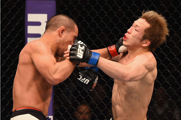 LAS VEGAS, NV - JANUARY 02: (L-R) Joe Soto punches Michinori Tanaka of Japan in their bantamweight bout during the UFC 195 event inside MGM Grand Garden Arena on January 2, 2016 in Las Vegas, Nevada. (Photo by Josh Hedges/Zuffa LLC/Zuffa LLC via Getty Im