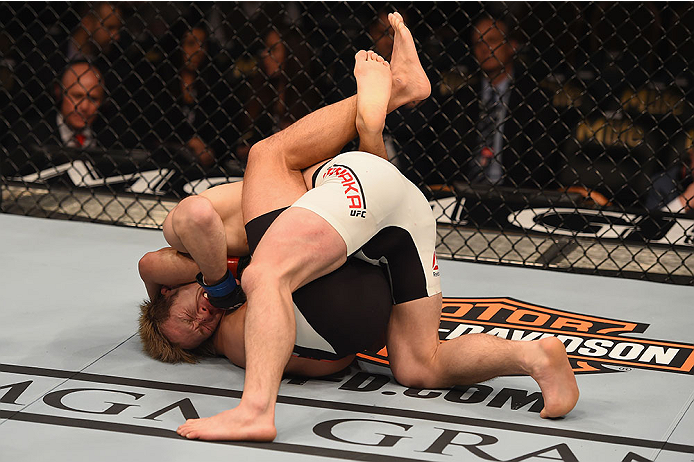 LAS VEGAS, NV - JANUARY 02: Joe Soto (bottom) attempts to submit Michinori Tanaka of Japan in their bantamweight bout during the UFC 195 event inside MGM Grand Garden Arena on January 2, 2016 in Las Vegas, Nevada. (Photo by Josh Hedges/Zuffa LLC/Zuffa LL