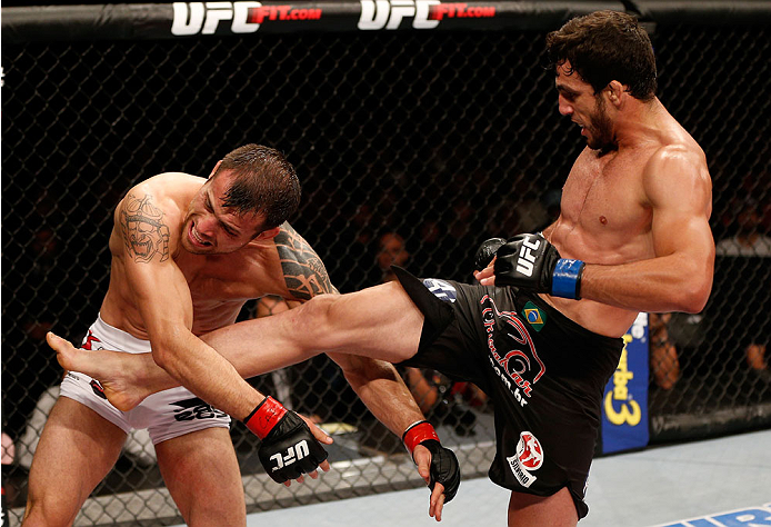 BELO HORIZONTE, BRAZIL - SEPTEMBER 04: (R-L) Elias Silverio kicks Joao Zeferino in their welterweight fight during the UFC on FOX Sports 1 event at Mineirinho Arena on September 4, 2013 in Belo Horizonte, Brazil. (Photo by Josh Hedges/Zuffa LLC/Zuffa LLC