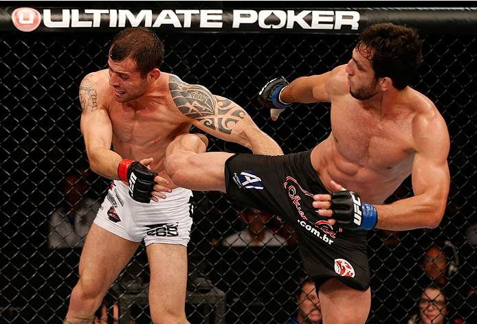 BELO HORIZONTE, BRAZIL - SEPTEMBER 04: (R-L) Elias Silverio kicks Joao Zeferino in their welterweight fight during the UFC on FOX Sports 1 event at Mineirinho Arena on September 4, 2013 in Belo Horizonte, Brazil. (Photo by Josh Hedges/Zuffa LLC/Zuffa LLC