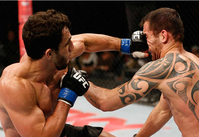 BELO HORIZONTE, BRAZIL - SEPTEMBER 04: (L-R) Elias Silverio punches Joao Zeferino in their welterweight fight during the UFC on FOX Sports 1 event at Mineirinho Arena on September 4, 2013 in Belo Horizonte, Brazil. (Photo by Josh Hedges/Zuffa LLC/Zuffa L