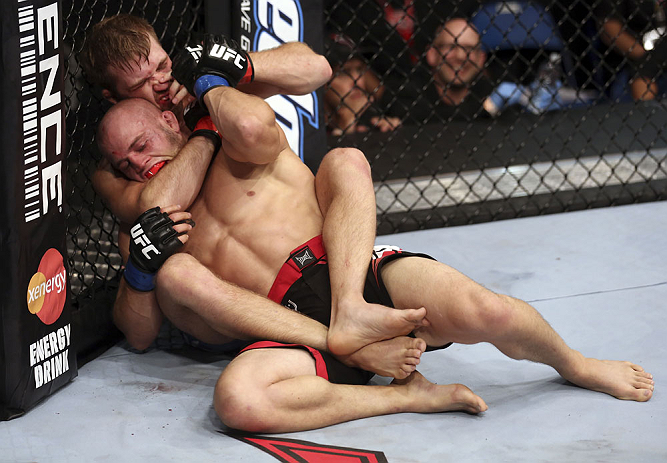 CALGARY, CANADA - JULY 21: Bryan Caraway attempts to choke out Mitch Gagnon during their bantamweight bout at UFC 149 inside the Scotiabank Saddledome on July 21, 2012 in Calgary, Alberta, Canada. (Photo by Nick Laham/Zuffa LLC/Zuffa LLC via Getty Image
