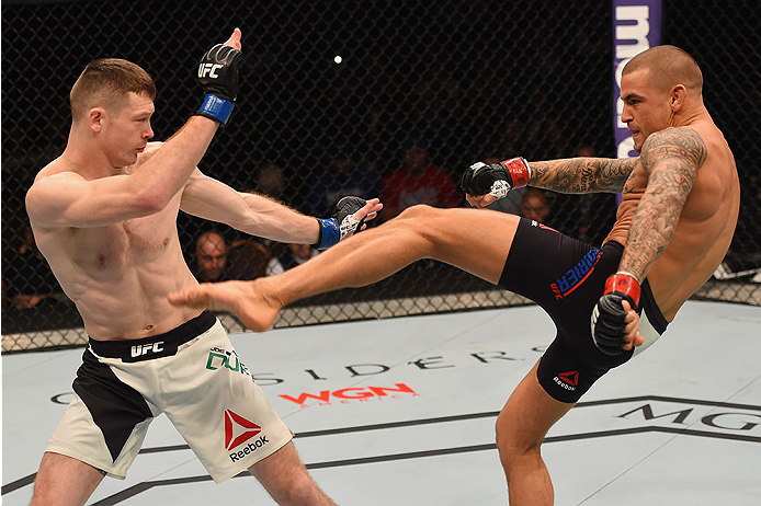 LAS VEGAS, NV - JANUARY 02: (R-L) Dustin Poirier kicks Joe Duffy of Ireland in their lightweight bout during the UFC 195 event inside MGM Grand Garden Arena on January 2, 2016 in Las Vegas, Nevada. (Photo by Josh Hedges/Zuffa LLC/Zuffa LLC via Getty Imag