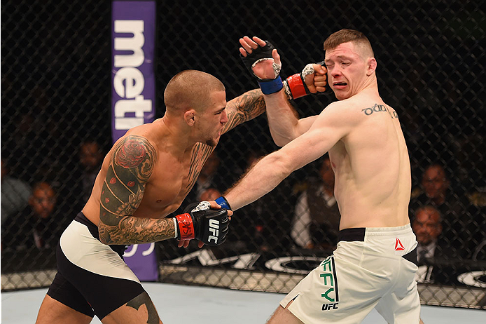 LAS VEGAS, NV - JANUARY 02: (L-R) Dustin Poirier punches Joe Duffy of Ireland in their lightweight bout during the UFC 195 event inside MGM Grand Garden Arena on January 2, 2016 in Las Vegas, Nevada. (Photo by Josh Hedges/Zuffa LLC/Zuffa LLC via Getty Im