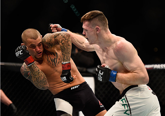 LAS VEGAS, NV - JANUARY 02: (R-L) Joe Duffy of Ireland punches Dustin Poirier in their lightweight bout during the UFC 195 event inside MGM Grand Garden Arena on January 2, 2016 in Las Vegas, Nevada. (Photo by Jeff Bottari/Zuffa LLC/Zuffa LLC via Getty I
