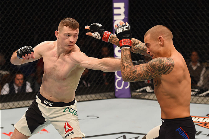 LAS VEGAS, NV - JANUARY 02: (L-R) Joe Duffy of Ireland punches Dustin Poirier in their lightweight bout during the UFC 195 event inside MGM Grand Garden Arena on January 2, 2016 in Las Vegas, Nevada. (Photo by Josh Hedges/Zuffa LLC/Zuffa LLC via Getty Im