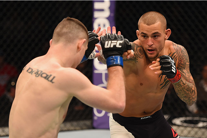 LAS VEGAS, NV - JANUARY 02: (R-L) Dustin Poirier punches Joe Duffy of Ireland in their lightweight bout during the UFC 195 event inside MGM Grand Garden Arena on January 2, 2016 in Las Vegas, Nevada. (Photo by Josh Hedges/Zuffa LLC/Zuffa LLC via Getty Im